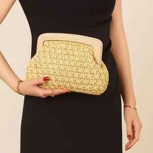Elegant woven straw evening clutch bag featuring a chic cream acrylic frame clasp