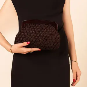 Elegant handmade brown woven evening clutch bag with dark acrylic frame detail view