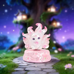 Detailed macro view of a translucent Nine-Tailed Fox figure with cherry blossom relief