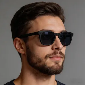 Detail view of matte black square frame sunglasses with silver rivets on male model