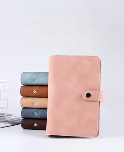 Detailed close-up of pink A6 faux leather budget binder with metal snap button closure