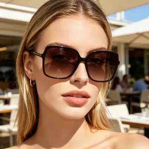 Close-up of stylish oversized square sunglasses with black frame and gradient lenses