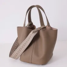 Premium brown genuine leather bucket bag with ethnic patterned wide shoulder strap