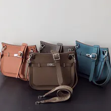 Three vintage genuine leather shoulder bags in terracotta, taupe, and teal colors
