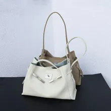 Close-up of large capacity genuine leather vintage tote bags in white and taupe colors.