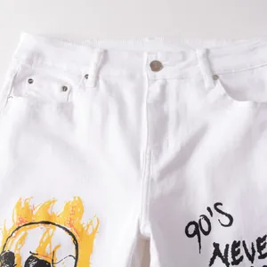 White street style skinny jeans for men featuring 90's NEVER text and skull prints