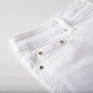 Men's white slim fit jeans featuring 3D skull graffiti print and silver rivets