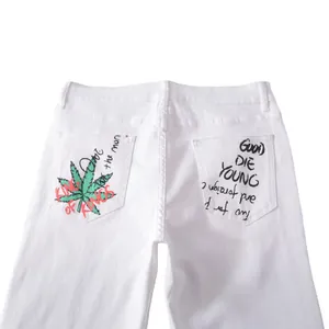 Men's slim fit white denim jeans with graffiti print on back pockets and streetwear style