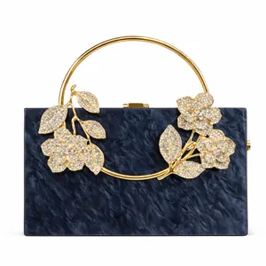 Navy marble acrylic evening clutch bag with gold floral rhinestone decor and round handle