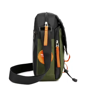 Men's olive green outdoor crossbody bag with orange zipper pullers and side patch