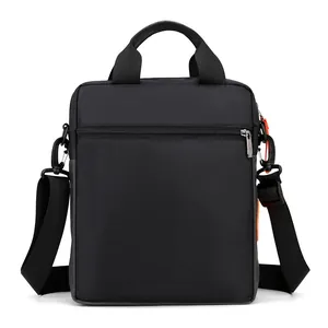 Waterproof black nylon messenger bag with top handle and adjustable shoulder strap