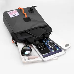 Waterproof grey nylon crossbody bag for men with tablet and daily essentials