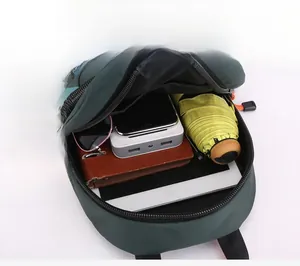 Internal storage view of green waterproof nylon chest bag with tablet and accessories