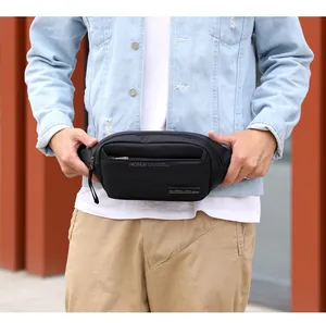 Outdoor black multifunctional waist bag on model showing waterproof nylon fabric texture