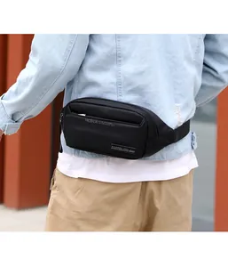 Outdoor waterproof nylon waist bag worn on hip with adjustable strap over denim jacket