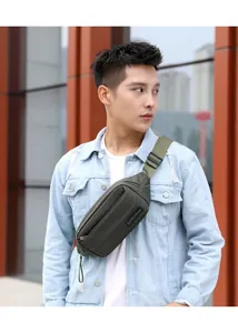 Close-up of olive green multifunctional waist bag with adjustable strap and brand logo
