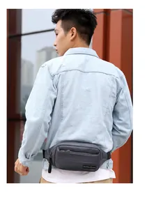 Outdoor multifunctional dark grey waist bag shown in a side-back view on a model