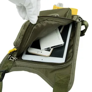Waterproof military green tactical leg bag showing large capacity for tablets and phones