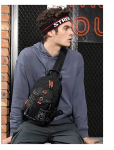 Detail view of waterproof black nylon chest bag with orange zippers and street style straps