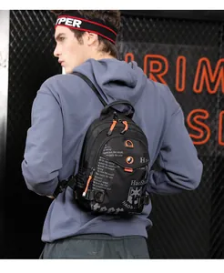 Detailed view of waterproof nylon chest bag with orange zipper accents and letter print
