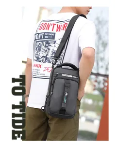 Close-up of gray men's crossbody chest bag with adjustable strap and waterproof fabric
