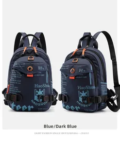 Detail view of dark blue waterproof nylon chest bag with graffiti prints and orange zippers