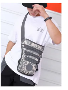 Detail of waterproof oxford drop leg bag with digital camouflage pattern and adjustable strap