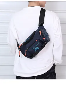 Rear view of a model wearing a waterproof navy blue multi-pocket waist bag with orange zippers