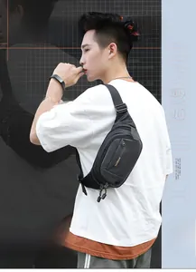 Detailed view of waterproof sports waist bag with multiple zippers and durable nylon strap