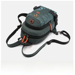 Outdoor waterproof nylon chest bag in dark green with vibrant orange zipper puller details