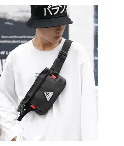 Detail of black nylon chest bag showing the brand logo and durable adjustable strap