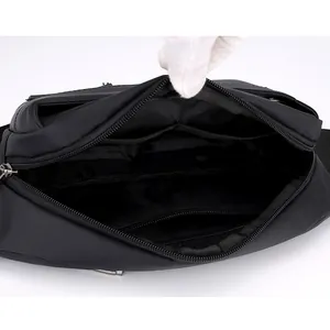 Black outdoor multifunctional waist bag with multiple zipper compartments for storage