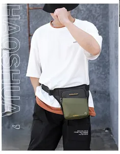 Close-up of olive green tactical leg bag with waterproof nylon fabric and adjustable strap