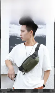 Outdoor waterproof nylon waist bag in army green shown on model for running and hiking