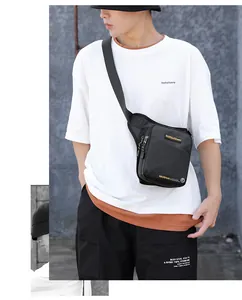 Front view of black tactical crossbody bag with multiple zippers and durable fabric