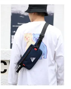 Detail showing the adjustable buckle and navy blue oxford fabric of the men's cross-body bag