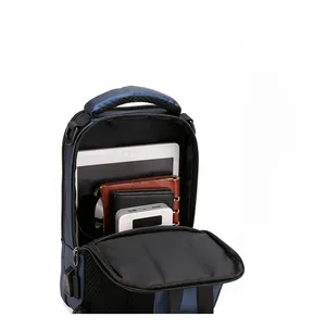 Detail view of large interior compartment holding a tablet and power bank in navy chest bag