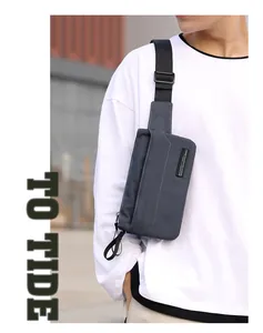 Side view of outdoor crossbody bag with adjustable strap and designer brand label
