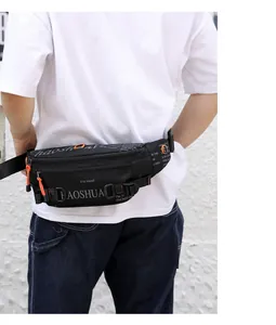 Detail of waterproof nylon waist bag with multiple orange zipper accents on a model