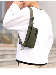 Outdoor model wearing military green waterproof nylon crossbody chest bag with adjustable strap