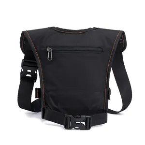 Tactical black nylon drop leg bag with orange stitching and adjustable buckle straps