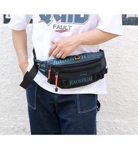 Detail of waterproof nylon waist bag with orange zippers and adjustable strap for hiking