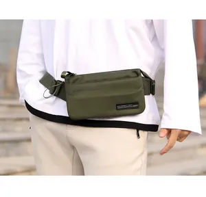 Outdoor military green tactical crossbody bag worn by male model in lifestyle setting