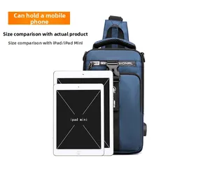 Blue men's sling bag with USB charging port shown with iPad to demonstrate large capacity