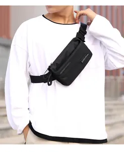 Close-up of black sports waist bag showing textured nylon fabric and dual zippers
