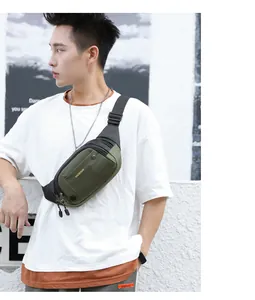 Detail of army green waterproof nylon crossbody bag with adjustable strap and zippers