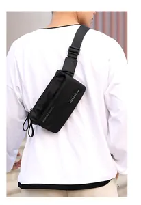 Rear view of man wearing black waterproof nylon waist bag for outdoor sports and travel