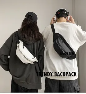 Rear view of model wearing trendy black waterproof waist bag with lettered webbing