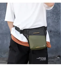 Detail of waterproof tactical waist bag with olive green and black nylon patchwork