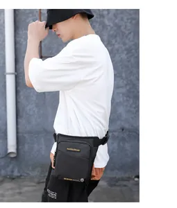 Detail of waterproof tactical leg bag with adjustable buckle straps and zipper compartments
